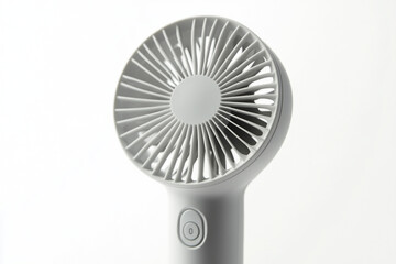 Close-up of modern portable handheld fan with minimalist design on white background