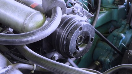 Older Car Air Conditioning Compressor Pulley Rotating