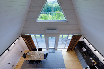 Charming A-Frame Cabin Interior with Modern Decor, Large Windows, and Scenic Nature Views, Perfect...