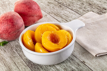 Sweet ripe yellow canned peaches