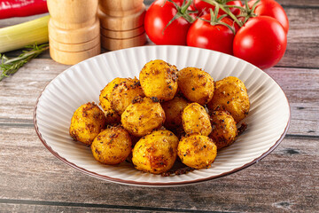 Baked small baby potato with herbs