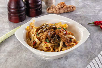 Asian cuisine udon with chicken and vegetables