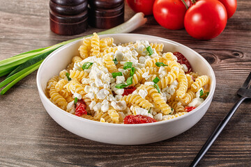 Italian pasta fusili with curd