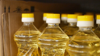 Close-up of many sunflower oil bottles in a cardboard box
