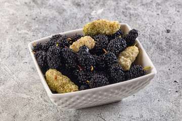 Ripe sweet juicy black and white mullberry