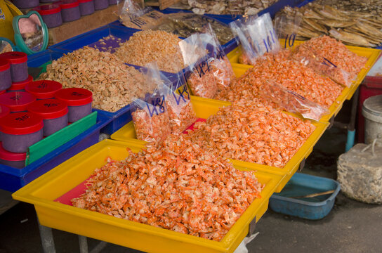 Dried raw shrimp and prawn preserves for sale at vendors seafood shop in Ang Sila jetty local market