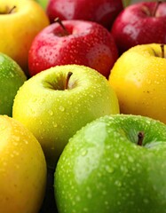 Closeup of Fresh red, yellow and green apples swith Water Droplets