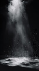 Spotlight illuminating stage with smoke on black background, theater performance concept.