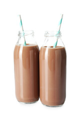 Tasty chocolate milk in glass bottles isolated on white
