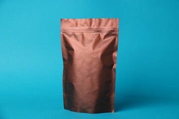 One zipper stand-up pouch on light blue background. Mockup for design