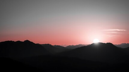 Fototapeta premium Mountains are silhouetted against a bright sunrise. 