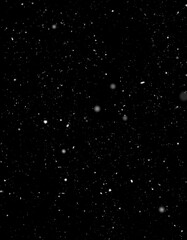 Falling Snowflakes Against A Dark Background
