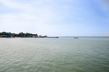 Fishing boat and ship floating in the sea for waiting fishing in night time in Chonburi, Thailand