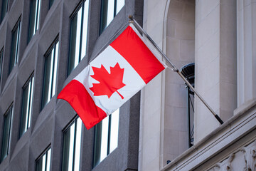 Canadian flag on government building in downtown of Ottawa, Ontario in Canada