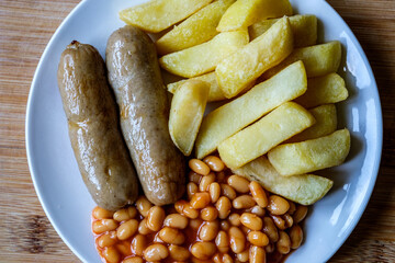 British Favourite Pork Sausages With Chips And Baked Beans In Tomato Sauce