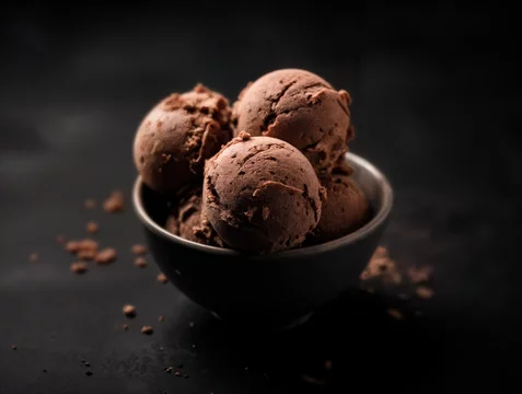 Gourmet Scoop of Hazelnut Ice Cream on Black Plate