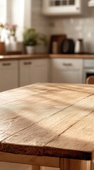 Sunlit rustic wooden table in a bright, blurred kitchen background