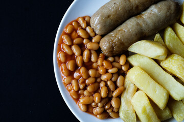 British Favourite Pork Sausages With Chips And Baked Beans In Tomato Sauce
