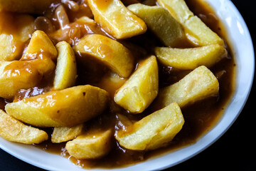 Plate of Wholesome Chips With Onion Gravy
