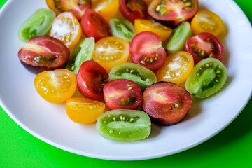 Selection of Small Sweet Colourful Sliced Raw Ripe Summer Tomatoes