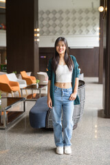 Full body portrait of a young woman in cafe restaurant