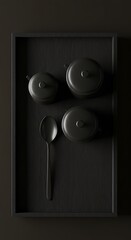 Dark kitchenware arranged neatly in frame