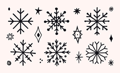 Set of hand-drawn black snowflakes and decorative winter elements. Minimalist doodle style. Perfect for Christmas cards, gift wrap, packaging, backgrounds, invitations, prints, clipart, and holiday de © Natalya
