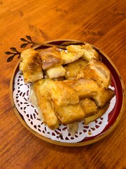 Sweet Glazed Toast Pieces on a Wooden Table