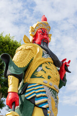 A majestic statue of Guan Yu, the revered Chinese general and deity symbolizing loyalty,...