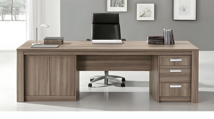 Modern executive desk with storage cabinet and drawers in a professional office setting