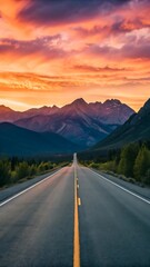 Fototapeta premium Scenic Highway Leading to Mountains Under Vibrant Sunset Sky