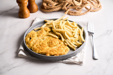 Milanese in breadcrumbs with French fries