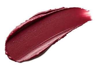 A close up of a smear of dark red lipstick on a black background with a smooth glossy texture