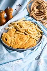 Milanese in breadcrumbs with French fries