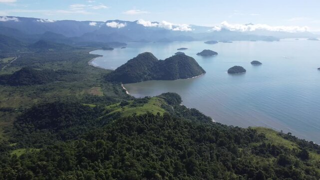 Drone view of Paraty, Rio de Janeiro, showcases lush Atlantic Forest, vibrant coastlines, and many small islands in the sparkling sea.