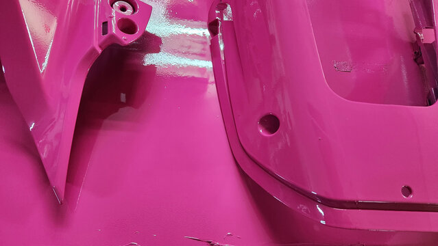 pink colored painted metal part background