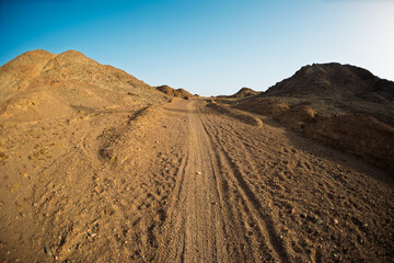 Road in the desert. Traveling through the desert of Israel. Tourism and travel in Israel. Eilat.