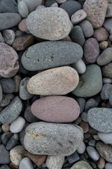 Stacked stones in a row on a stone background stone beach of Batumi