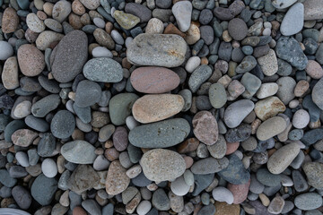Stacked stones in a row on a stone background, stone beach of Batumi