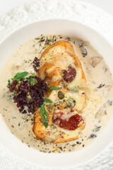 Portion of gourmet chicken fillet with mushroom sauce