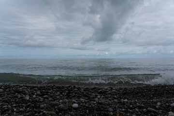 Waves of the Black Sea in Batumi. Stone beach and waves