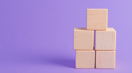Obraz premium Stacked wooden blocks against lavender background