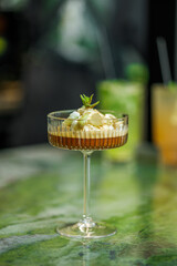 Delightful cocktail served in a stylish glass on a marble table in an elegant setting
