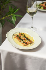 Portion of gourmet grilled shrimp skewers with sauce