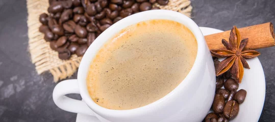  Coffee in cup and roasted dark coffee beans with anise and cinnamon © ratmaner