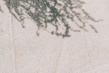 Beige natural cotton linen with lavender shadow and sunlight texture. Summer minimal aesthetic background for beauty and spa mockup template with empty space. Neutral boho style design flat lay.