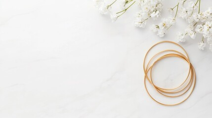 Delicate Gold Brace Flat Lay with White Flowers