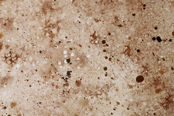 Surface with varied textures and colors, resembling natural stone or earth
