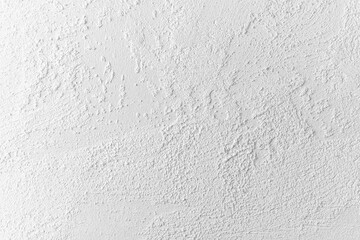 Textured white wall with subtle variations in surface detail and pattern
