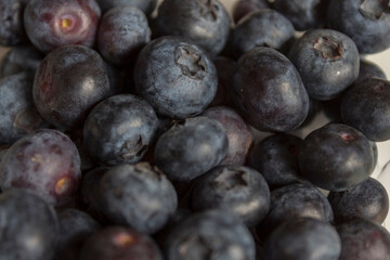Blueberries in a plastic bow bought from the market.